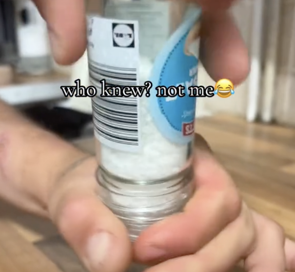 hand holding salt grinder upside down